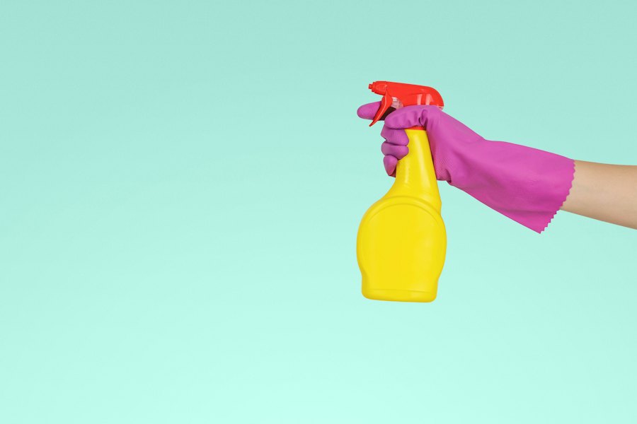 Cleaner wiping a surface during a home deep clean