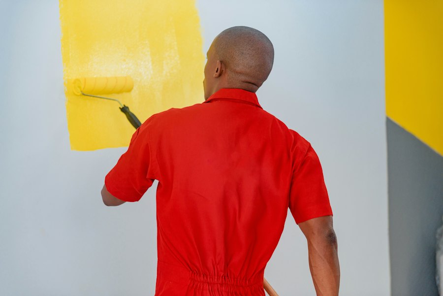 Painter rolling fresh paint onto an interior wall